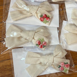 Flower embroidered bow on clip